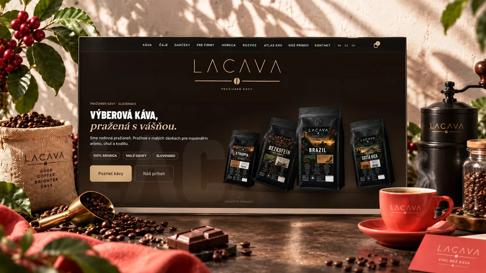 The LACAVA e-shop homepage on a screen among coffee beans and a red cup.