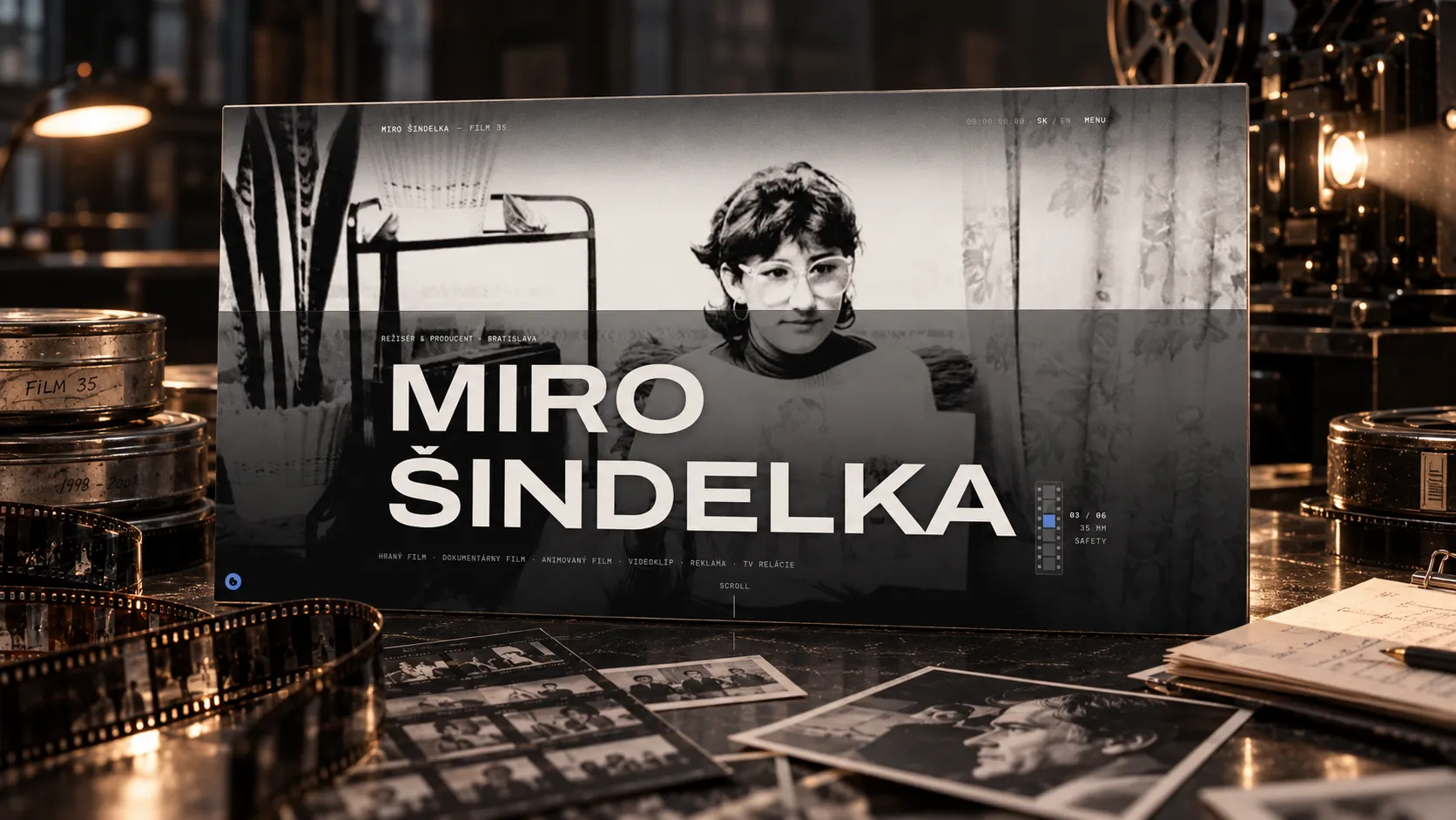 Miro Šindelka’s website set in a film archive with a 35 mm strip, reels and photographs.